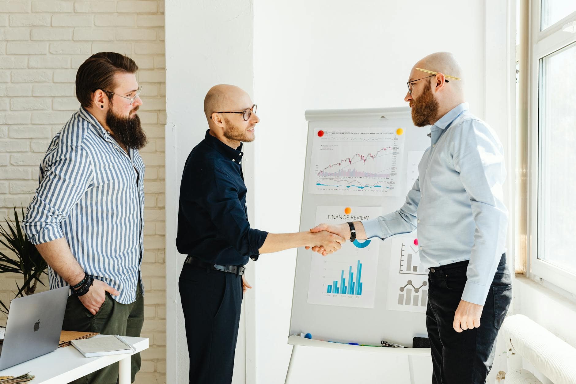 men making a presentation in an office