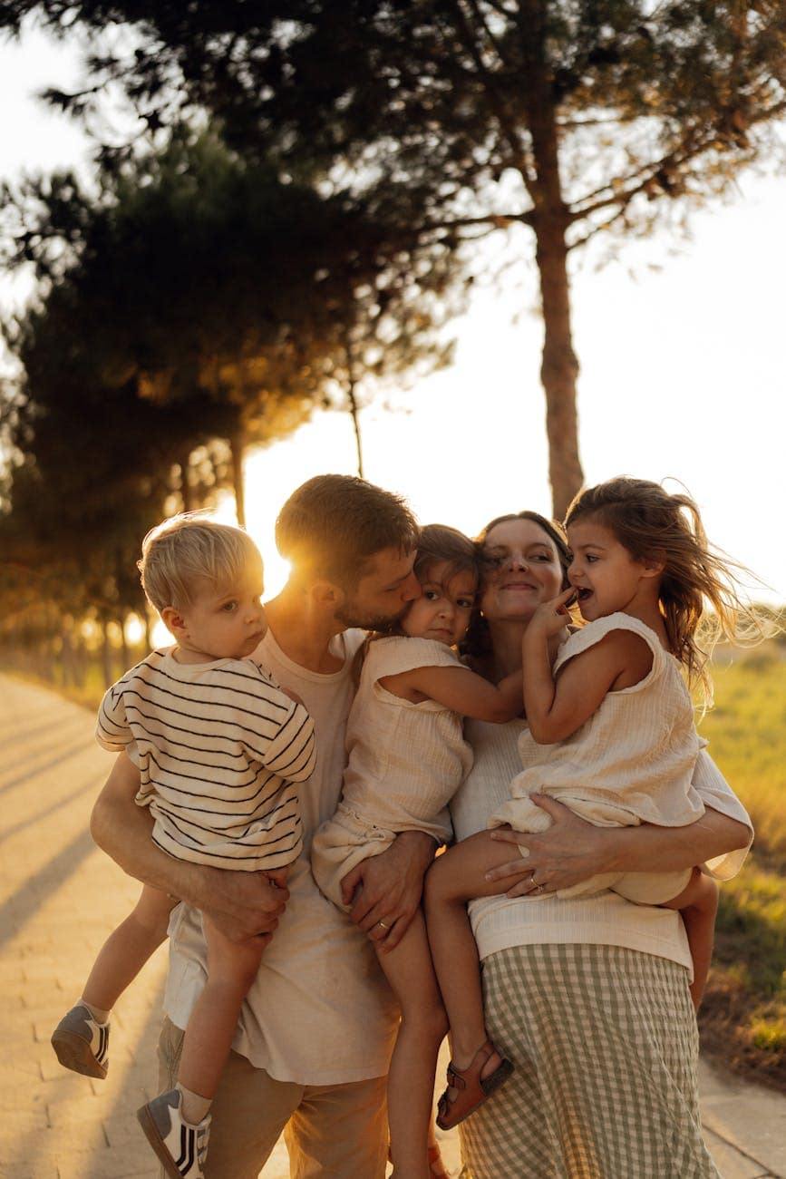happy family enjoying sunset in nature