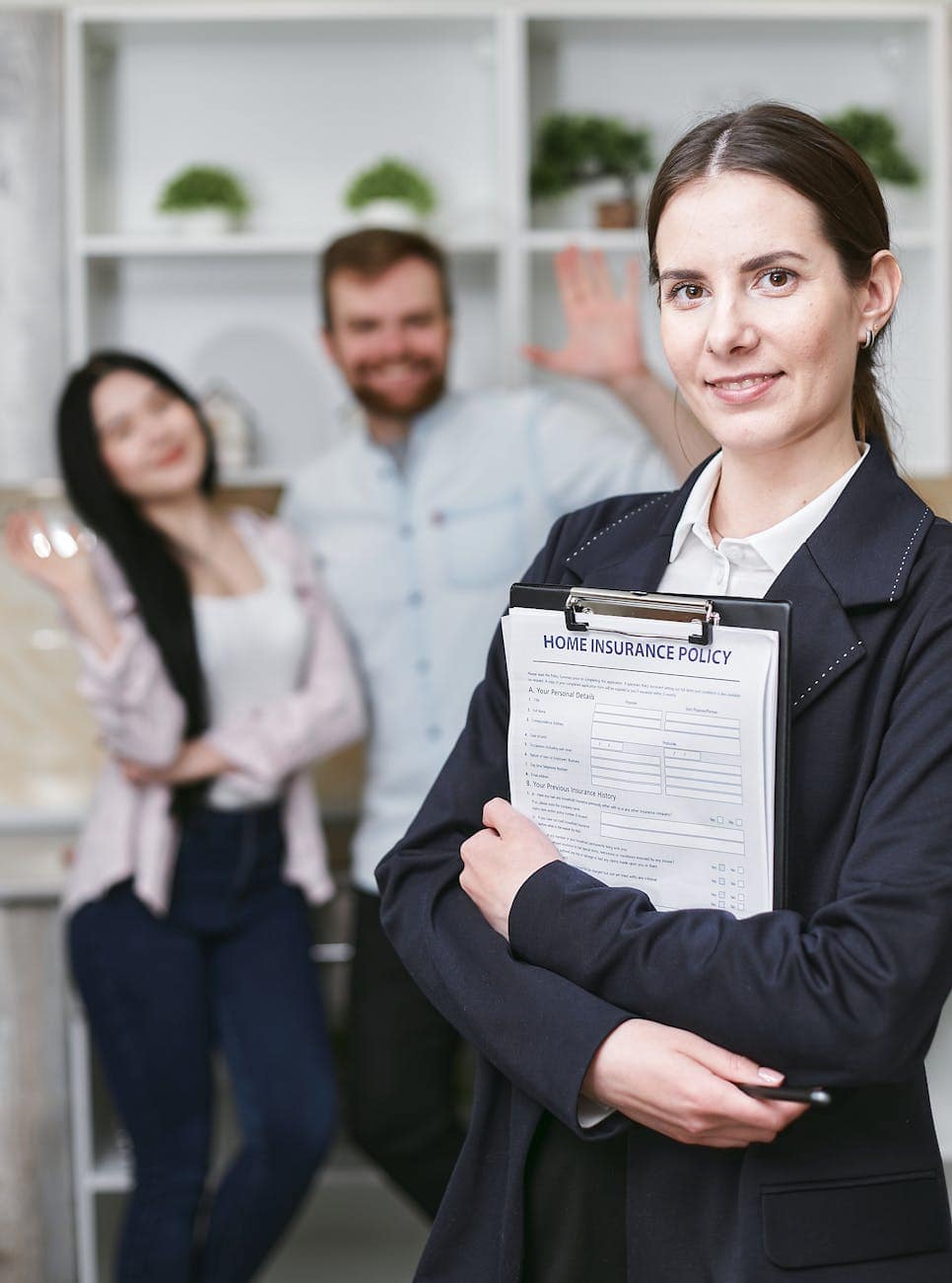 a woman smiling and holding an insurance contract